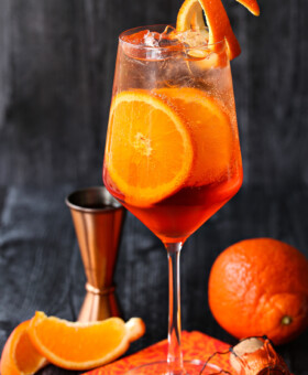 aperol spritz on napkin with orange slices