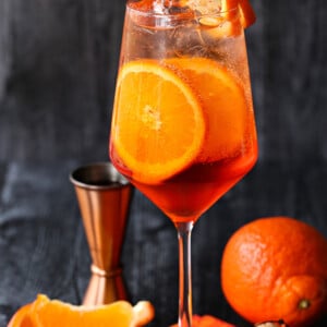 aperol spritz on napkin with orange slices