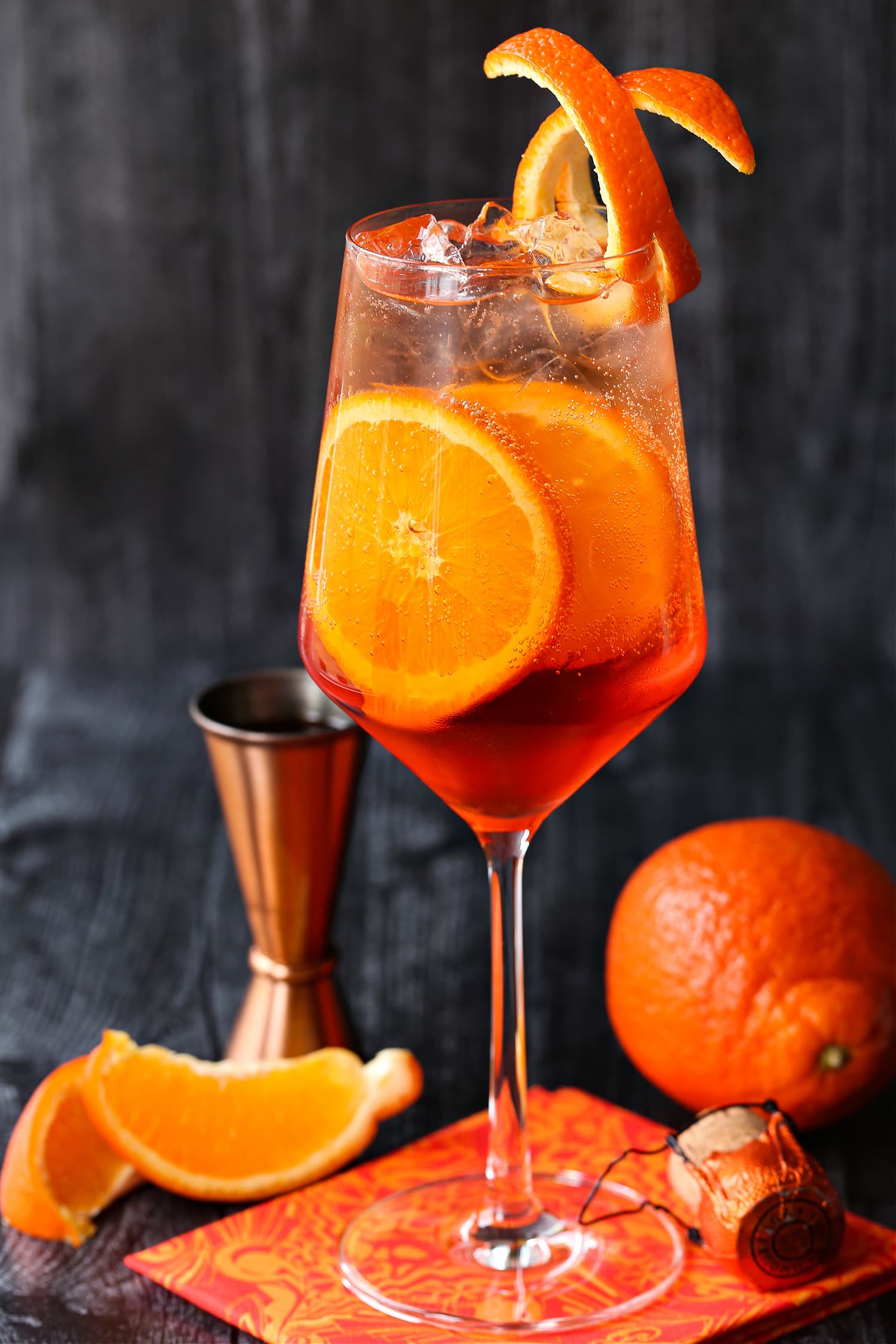 aperol spritz on napkin with orange slices