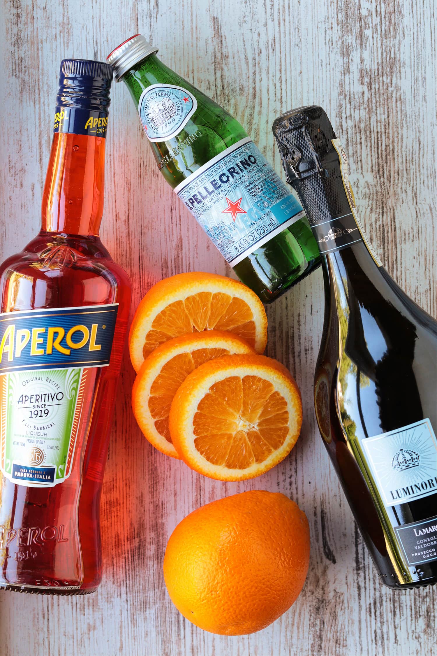 ingredients for making an aperol spritz cocktail