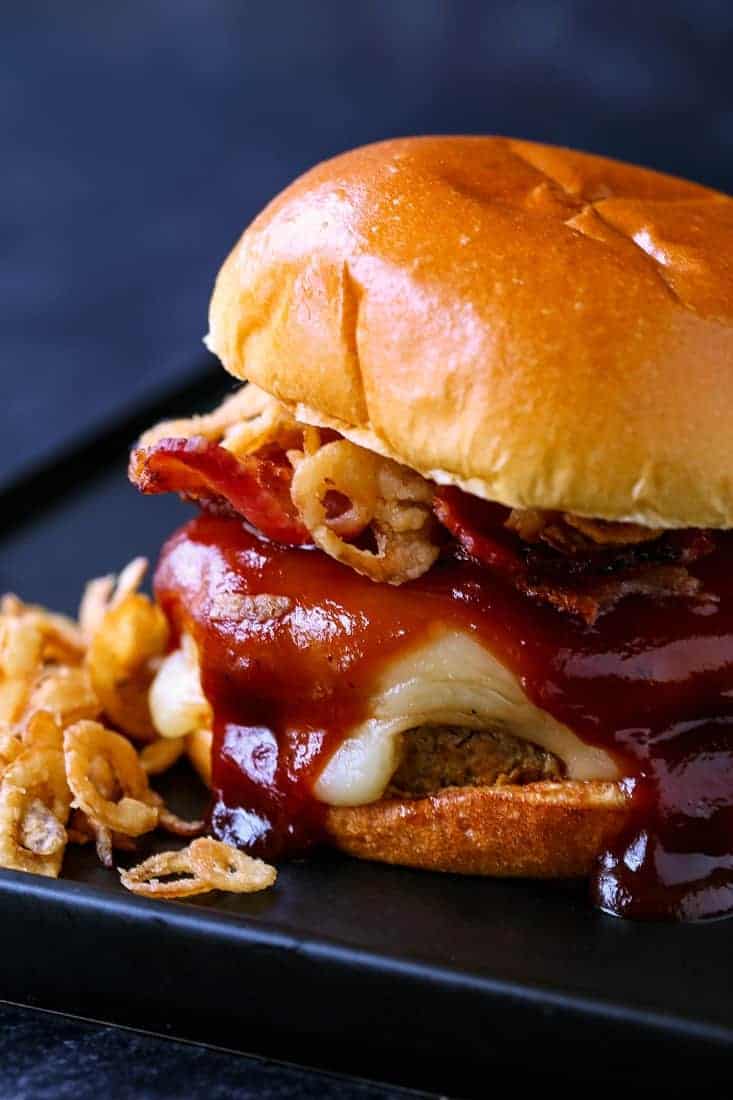 BBQ Bacon turkey burgers with fried onions on the side