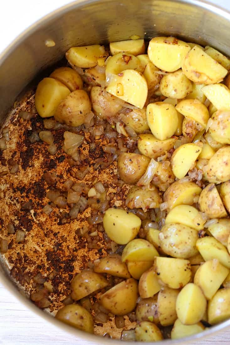potatoes and sausage in a soup pot to make potato soup