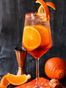 aperol spritz on napkin with orange slices
