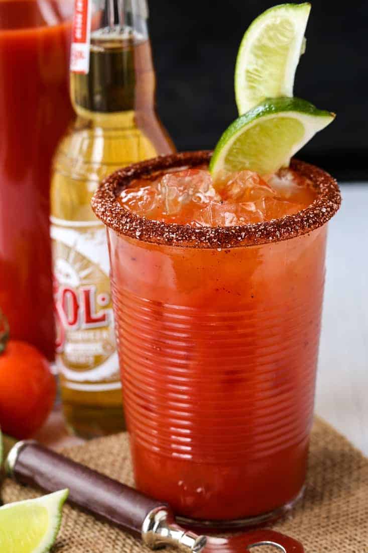 A Michelada cocktail with a spice rim