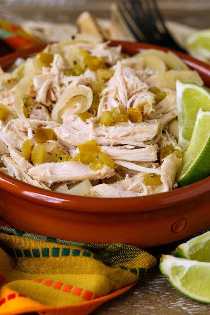 Slow Cooker Shredded Chicken in a bowl with a colorful napkin