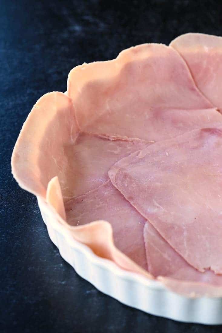 Ham layered in a pie plate for a low carb quiche recipe