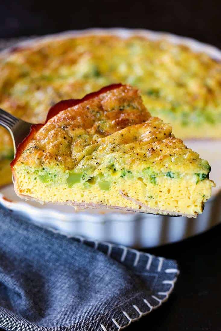 Crustless Quiche recipe with a wedge on a pie serve