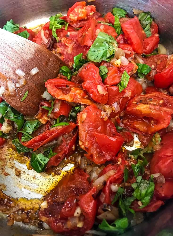 Roasted tomatoes and fresh basil to make tomato soup recipe