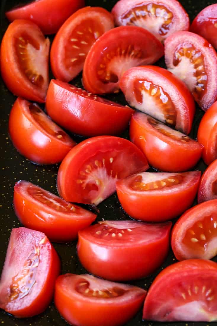 tomatoes on a sheet pan for roasting