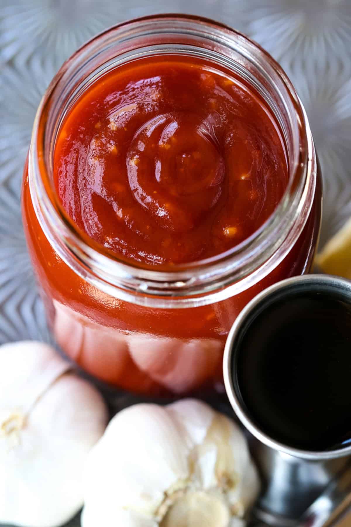Our famous Whiskey Steak Marinade! Let this marinade work overnight for a tender, flavorful steak with a perfect caramelized crust! whiskey marinade for steak in open mason jar
