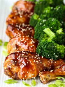 Chicken legs baked with an Asian flavored glaze served with broccoli