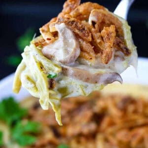 green bean casserole on serving spoon