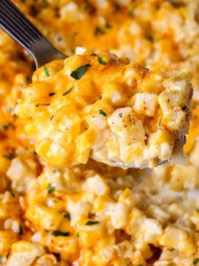 Cheesy Crock Pot Potatoes being served with a spoon