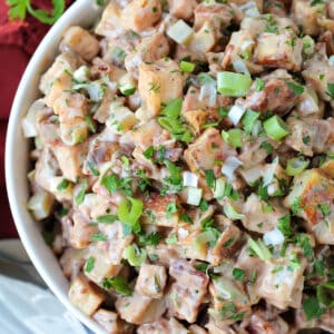 roasted potato salad with barbecue and mayonnaise dressing in bowl from the top