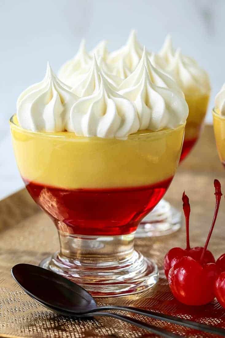 Boozy Cinnamon Toast Crunch Jello with spoons and cherries