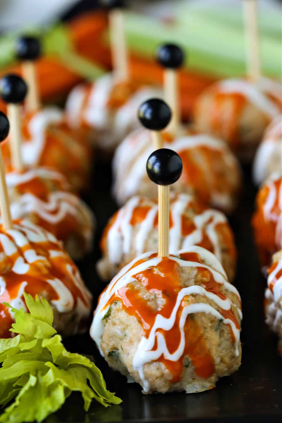 chicken meatballs with buffalo sauce and blue cheese drizzle