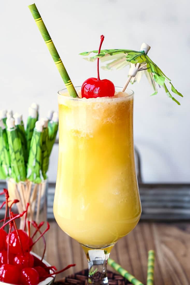 A Pina Colada drink with umbrella garnish