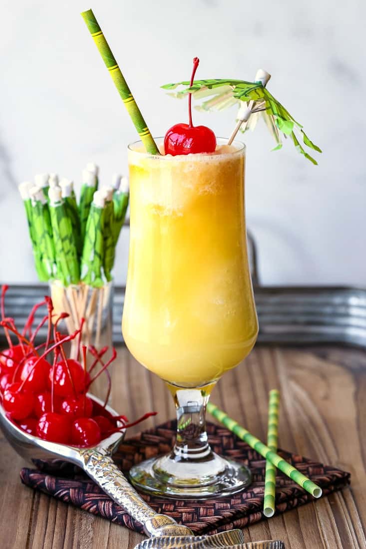 Pina Colada drink with garnish and straws