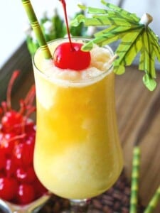 pina colada recipe with cherry and umbrella garnish