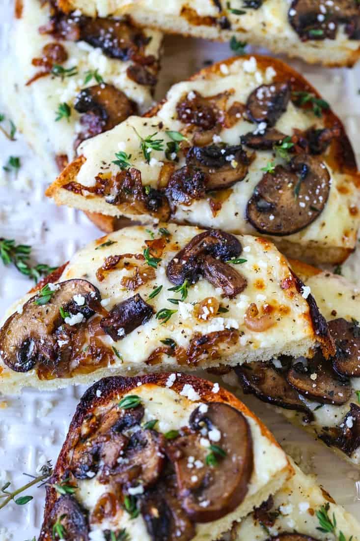 Mushroom and Thyme Cheese Bread appetizers sliced on platter