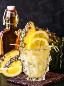 Whiskey lemonade cocktail with pineapple garnish