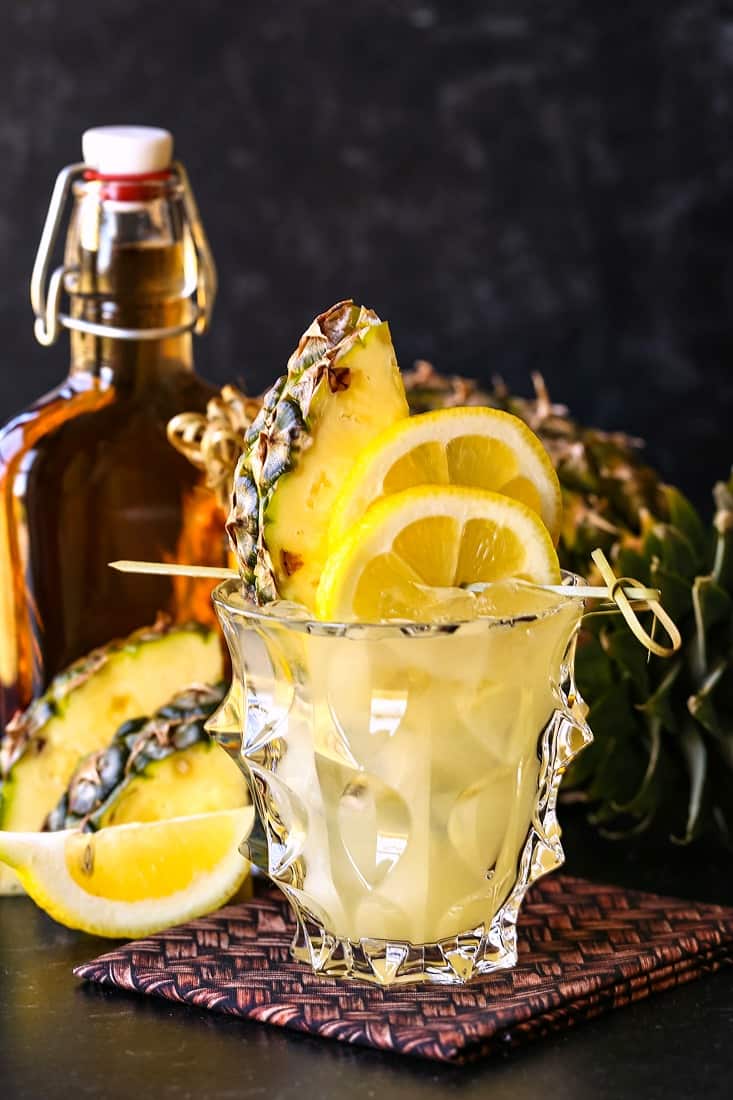 Whiskey lemonade cocktail with pineapple garnish