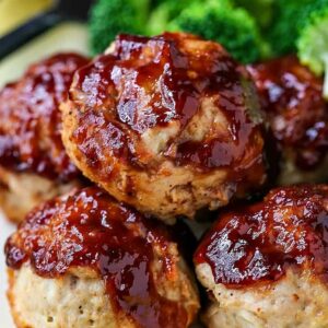 BBQ Meatloaf Muffins on a dinner plate with broccoli