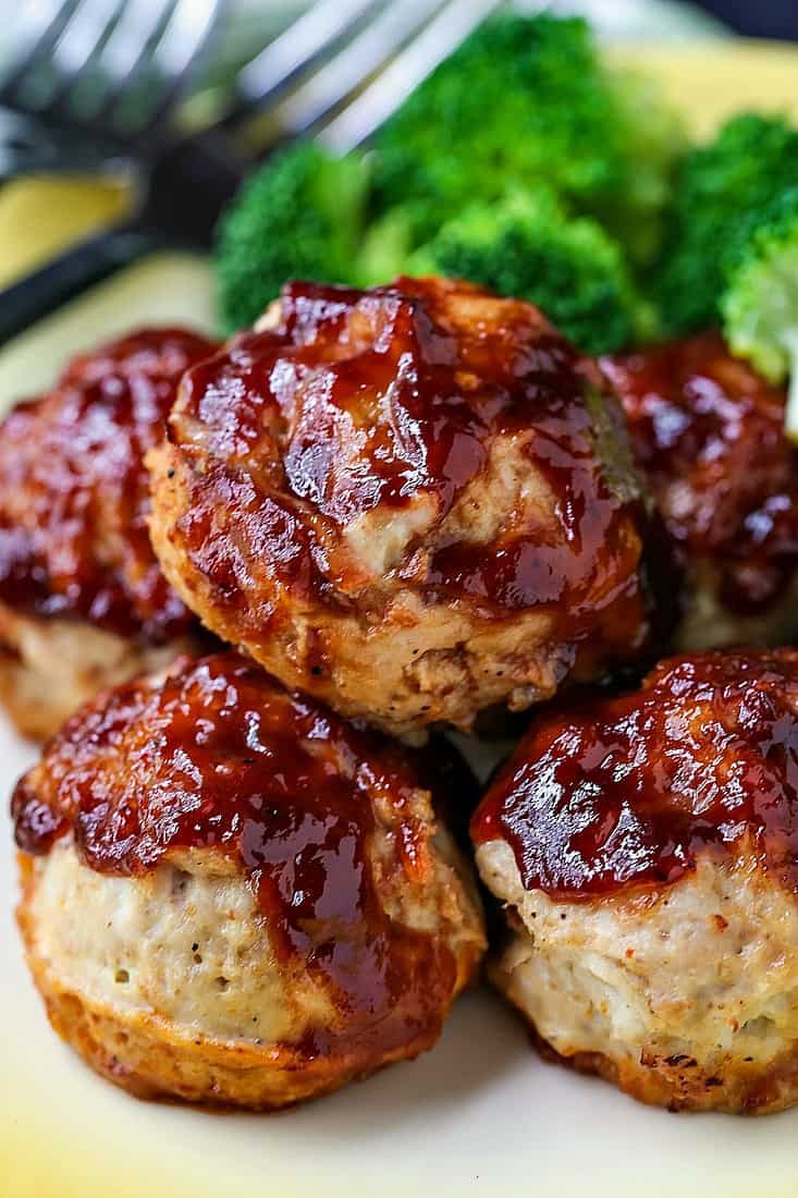 BBQ Meatloaf Muffins on a dinner plate with broccoli