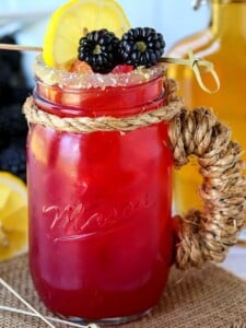 blackberry bourbon lemonade in mason jar glass