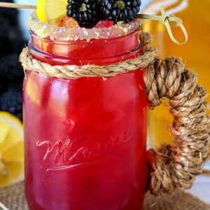 blackberry bourbon lemonade in mason jar glass