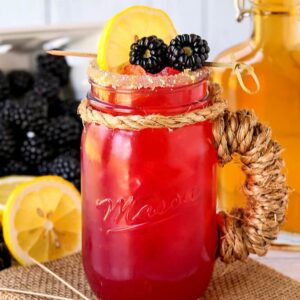 Blackberry bourbon lemonade in a mason jar glass