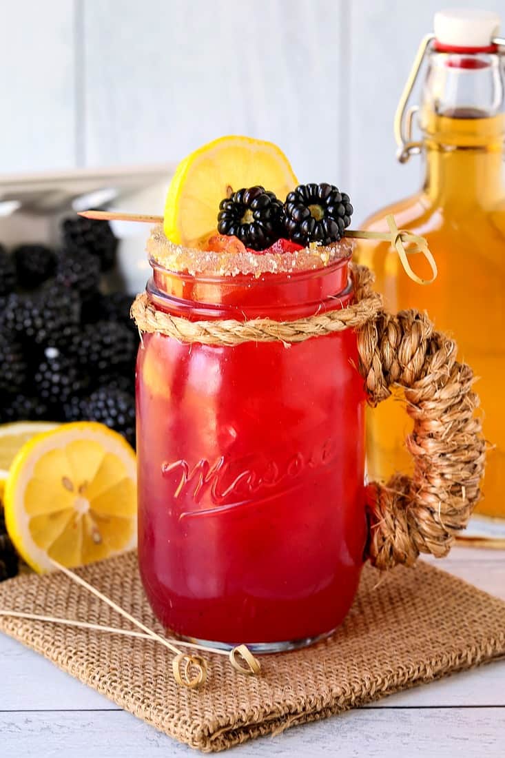 Blackberry bourbon lemonade in a mason jar glass