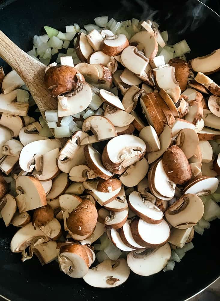 Mushrooms and onions in a skillet for casserole recipe