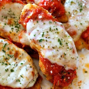 breaded chicken tenderloins with sauce and mozzarella cheese