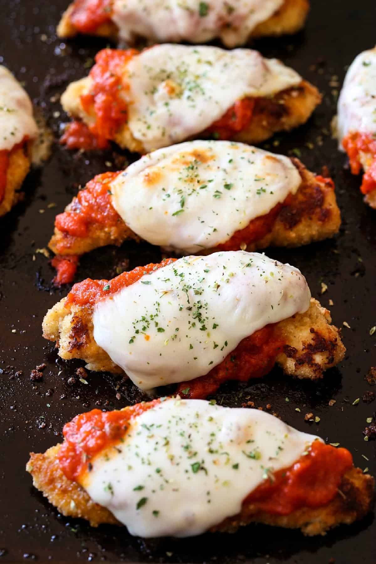 breaded chicken tenderloins with sauce and mozzarella cheese