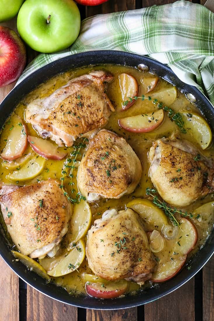 Chicken Thigh recipe with apples and gravy in skillet