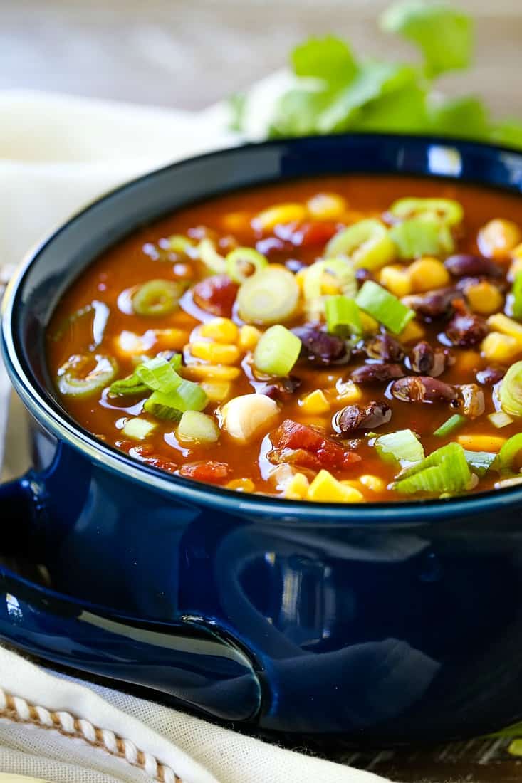 This Black Bean and Corn Soup is such an easy recipe! Your slow cooker does all the work for you, and blends the flavors together perfectly! Black bean soup recipe made in a slow cooker