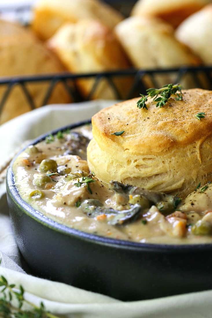 You only need ten minutes to start this Crock Pot Chicken Pot Pie! Super creamy sauce with tender chicken and veggies, topped with a biscuit! easy chicken pot pie recipe made in a slow cooker