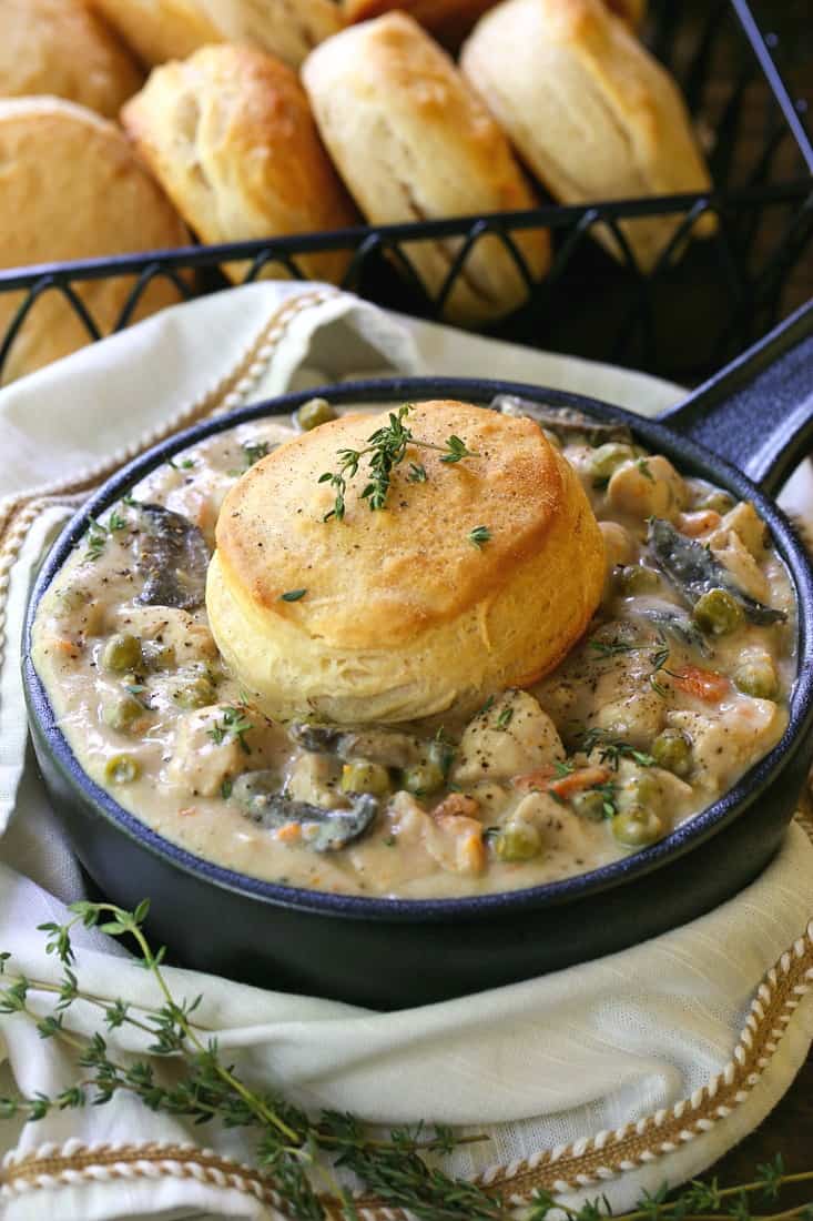 You only need ten minutes to start this Crock Pot Chicken Pot Pie! Super creamy sauce with tender chicken and veggies, topped with a biscuit! Chicken pot pie in a crock with a biscuit
