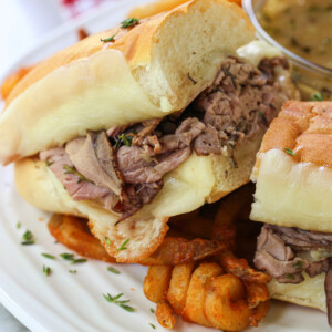 hot roast beef sandwich on a plate with fries