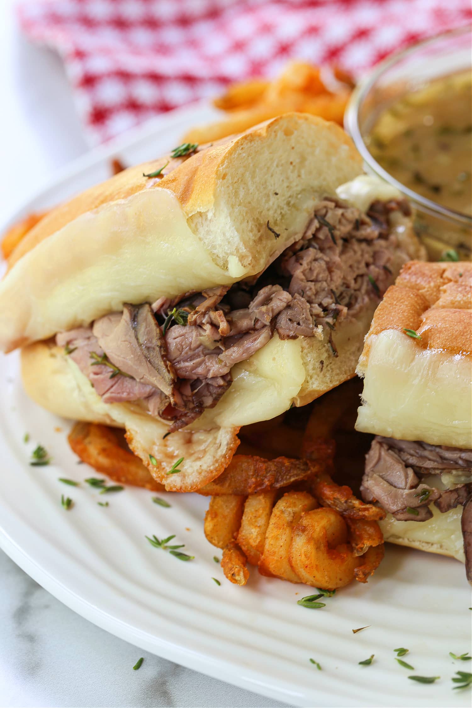 hot roast beef sandwich on a plate with fries