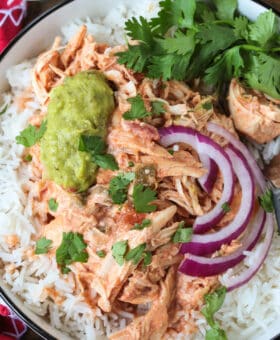 shredded salsa chicken over rice with onions and guacamole