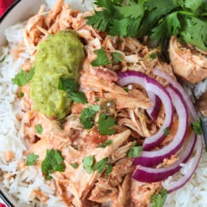 shredded salsa chicken over rice with onions and guacamole