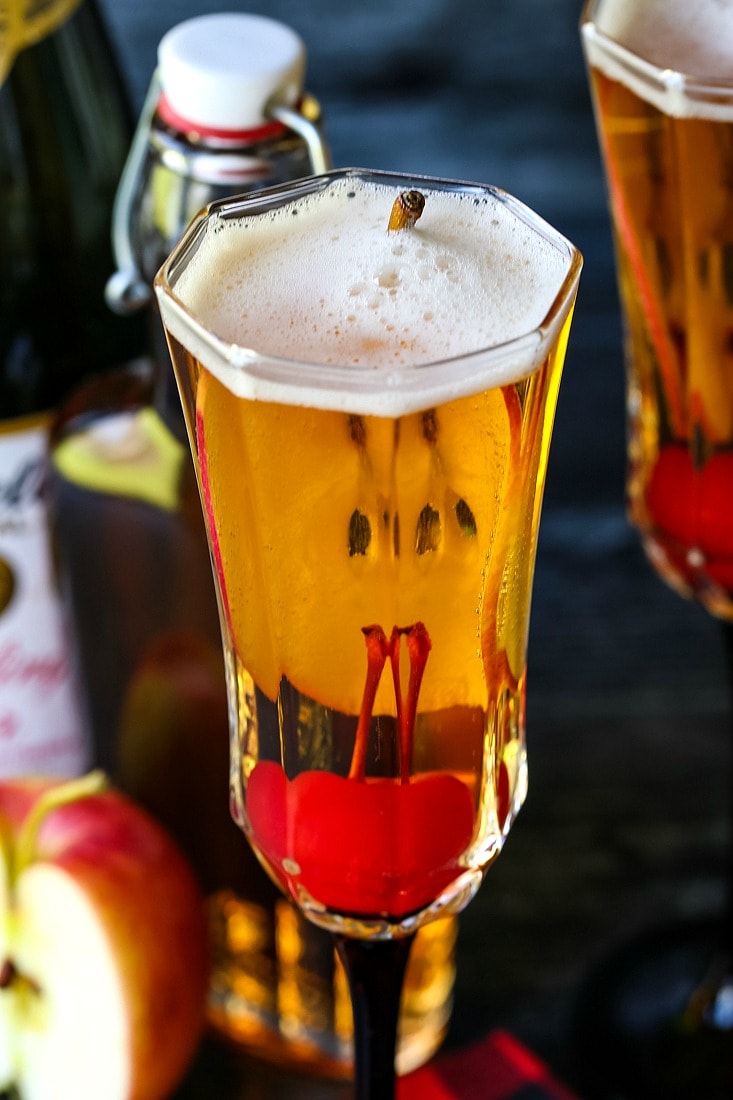 Apple Cider Cocktail with apple slice and cherry