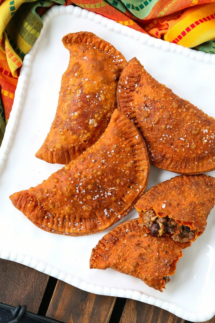 beef empanadas on a white platter