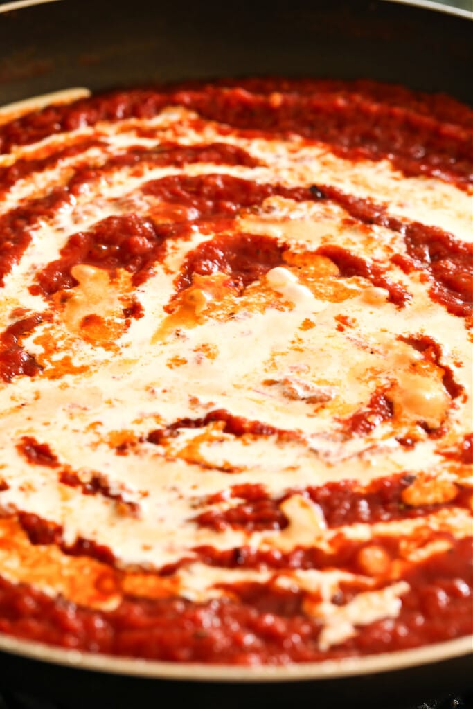 tomato sauce with cream swirled in