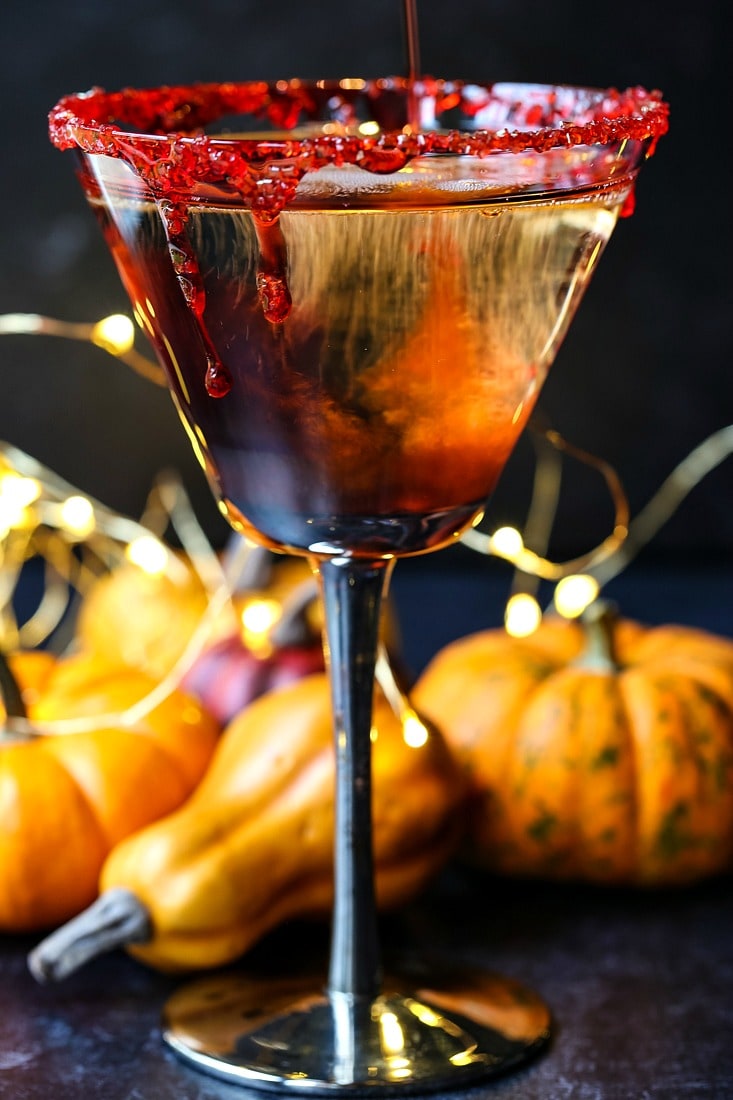 Vampire's Kiss Martini recipe with pumpkins in background