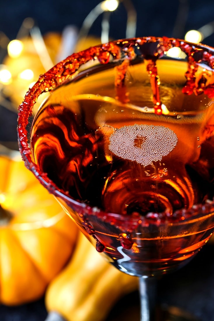 Halloween cocktail with fake blood dripping down glass