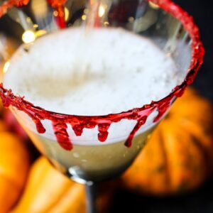 Champagne pouring into glass for Halloween drink recipe