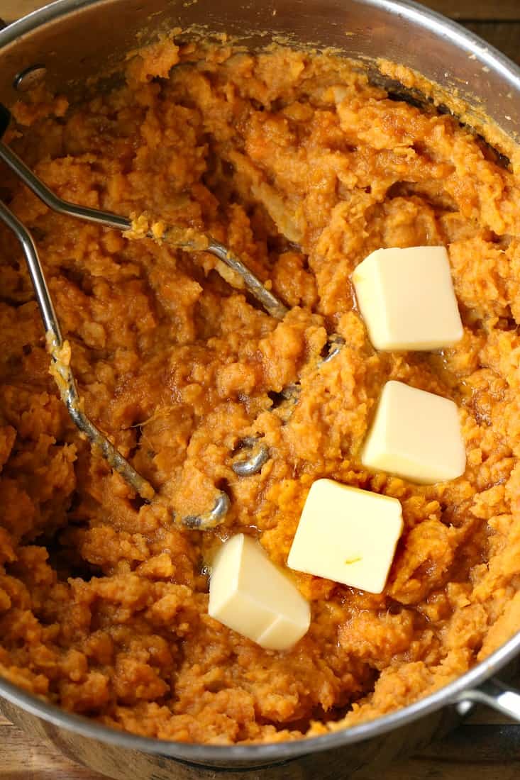 Mashed Sweet potatoes in a pot with butter
